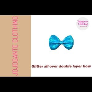 A hair bow. “Glitter all over double layer bow”